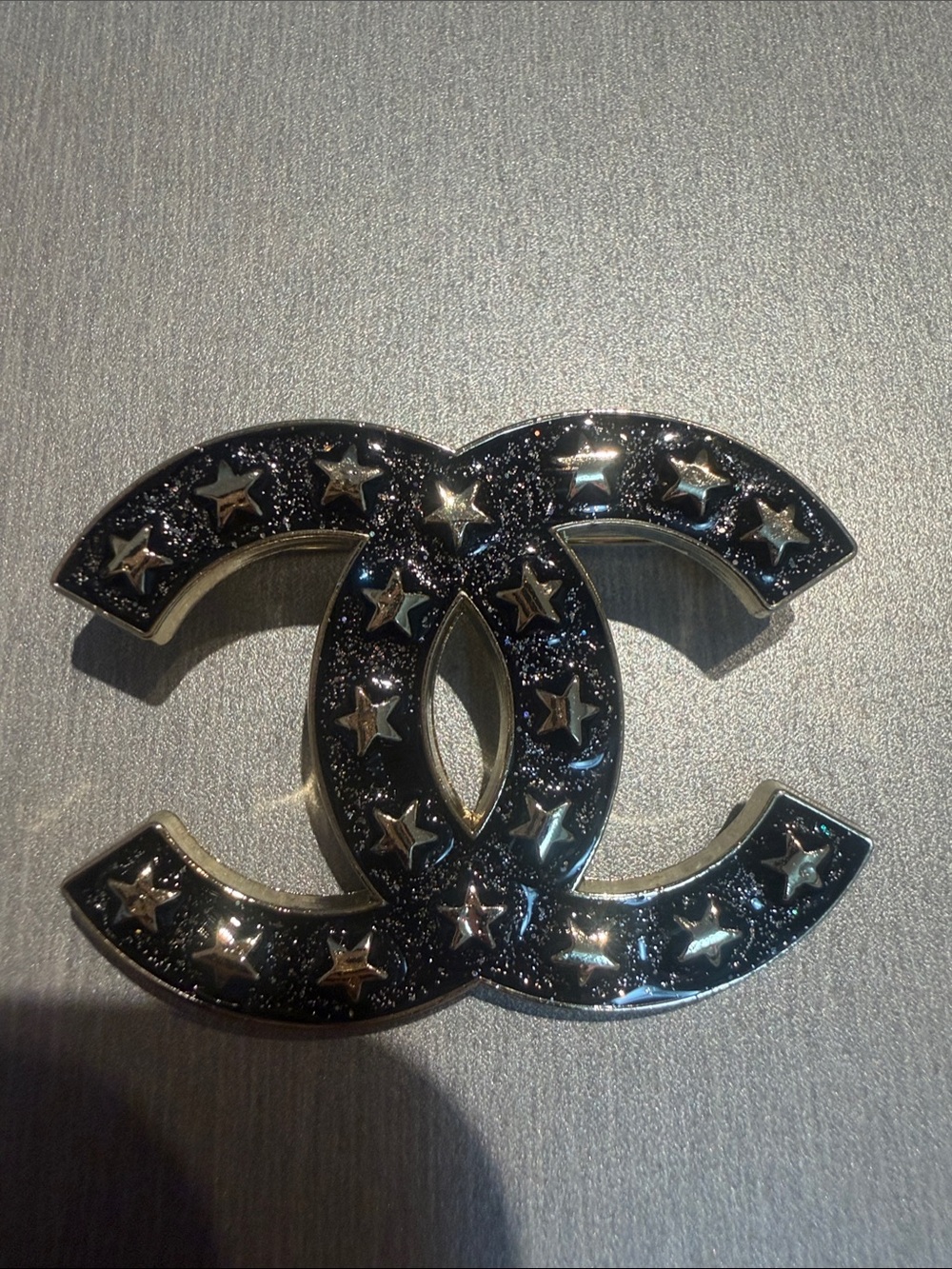 Inspired Black and Gold Star-Embellished Brooch